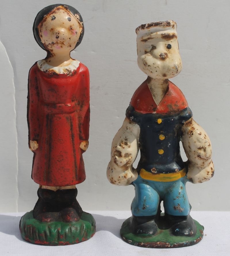 ca 1930 pr of cast iron Popeye & Olive Oyl penny banks: ca 1930 pr of cast iron Popeye & Olive Oyl penny banks in orig polychrome paint in very good cond w minor rust abrasion
