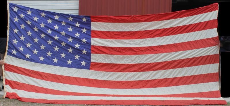 Huge 12'x17' mid 20thC nylon American Flag w 50 stars: Huge 12'x17' mid 20thC nylon American Flag w 50 stars labeled "Flag National USA" in very good condition