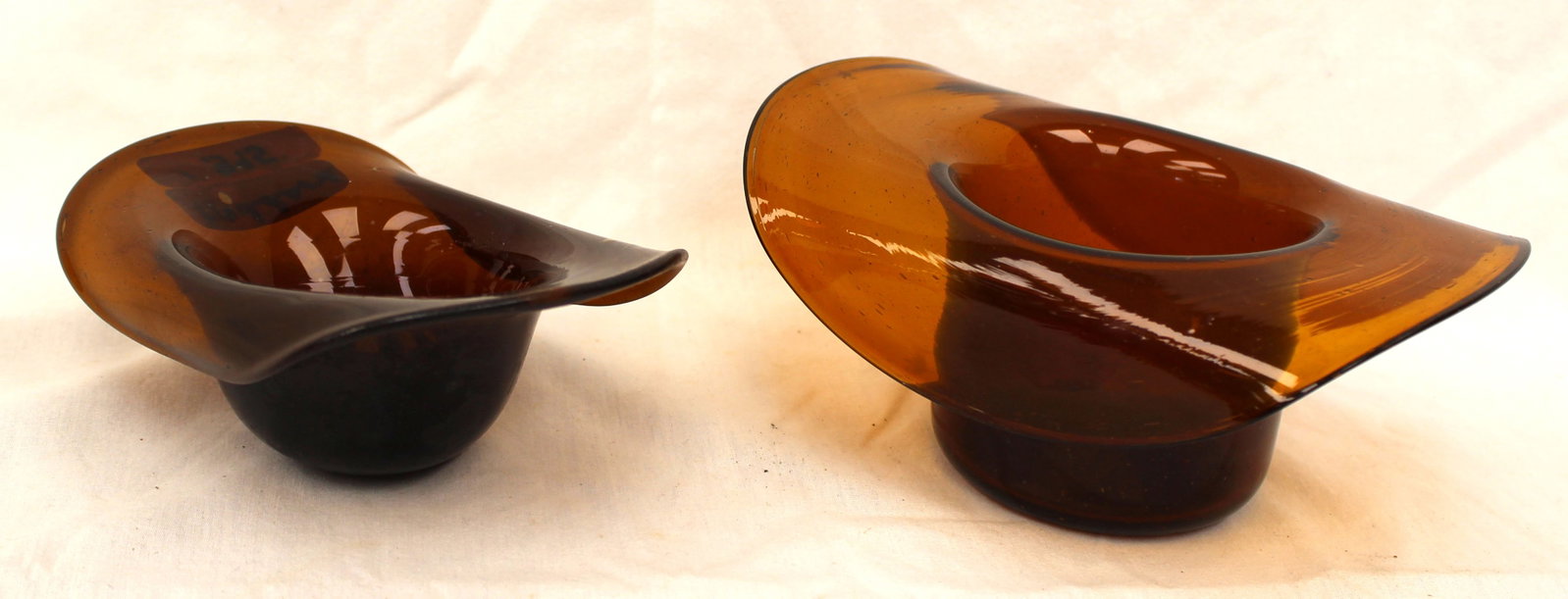Lot of 2 early amber glass hats - 1 3/4" tall x 5 1/4"x2 1/2" & 2 1/2" tall x 6 1/2"x4" (1 of 8)