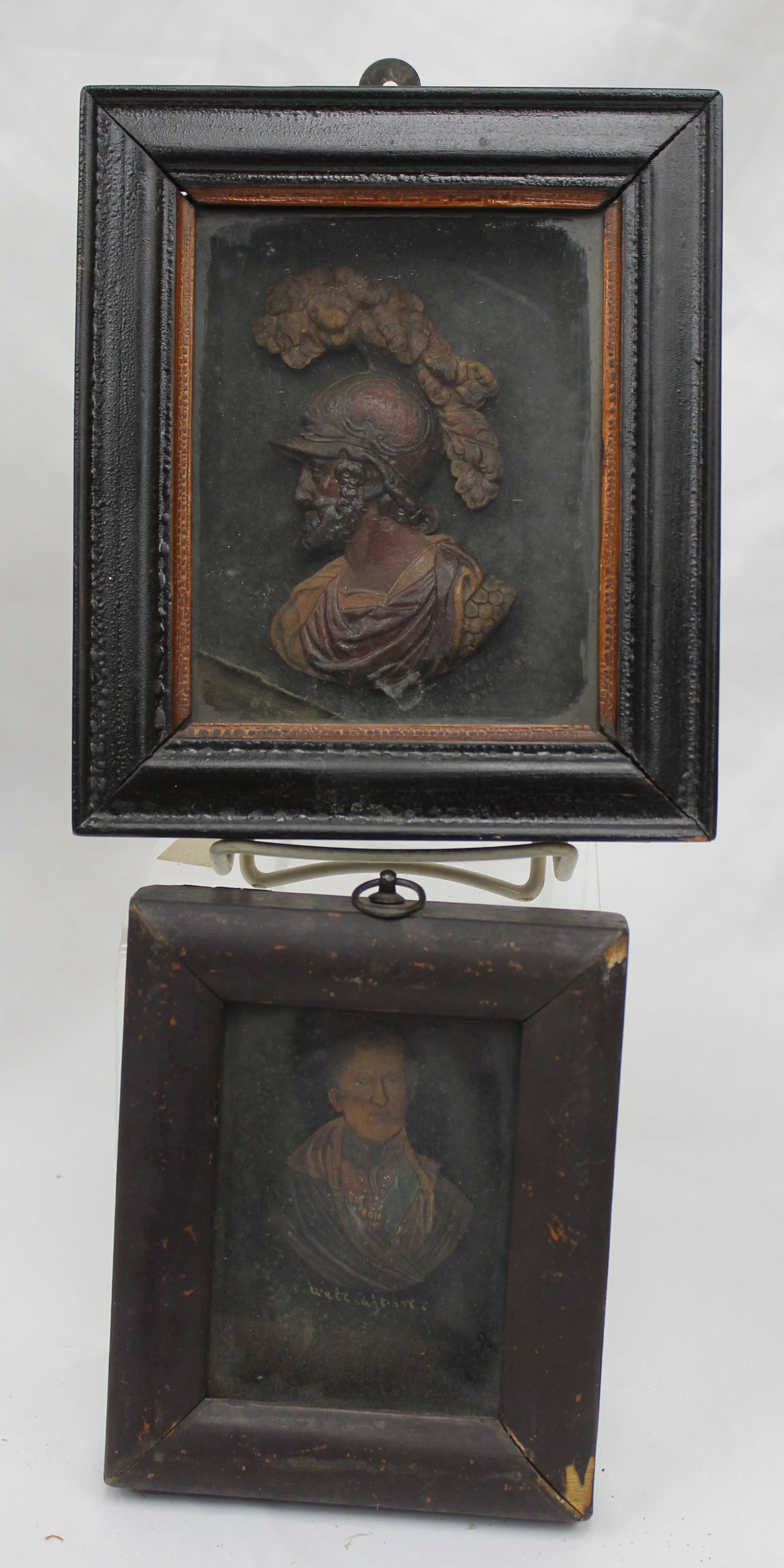 Lot of 2 carved wooden portrait busts of gentleman mounted on glass in shadowbox frames - titled: Lot of 2 carved wooden portrait busts of gentleman mounted on glass in shadowbox frames - titled "Alfred King of England" & "Wellington" on the glass the busts are mounted on - overall framed sizes 6"