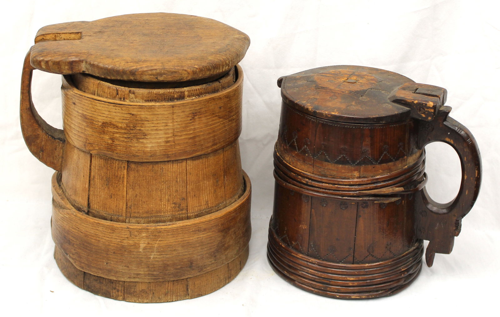 Lot of 2 antique wooden tankards - 1 w chip carved decoration - 11" & 9 1/2" tall: Lot of 2 antique wooden tankards - 1 w chip carved decoration - 11" & 9 1/2" tall