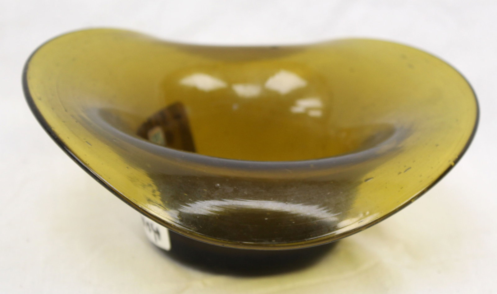 Early green glass hat - 2 1/2" tall x 7"x3 1/2": Early green glass hat - 2 1/2" tall x 7"x3 1/2"