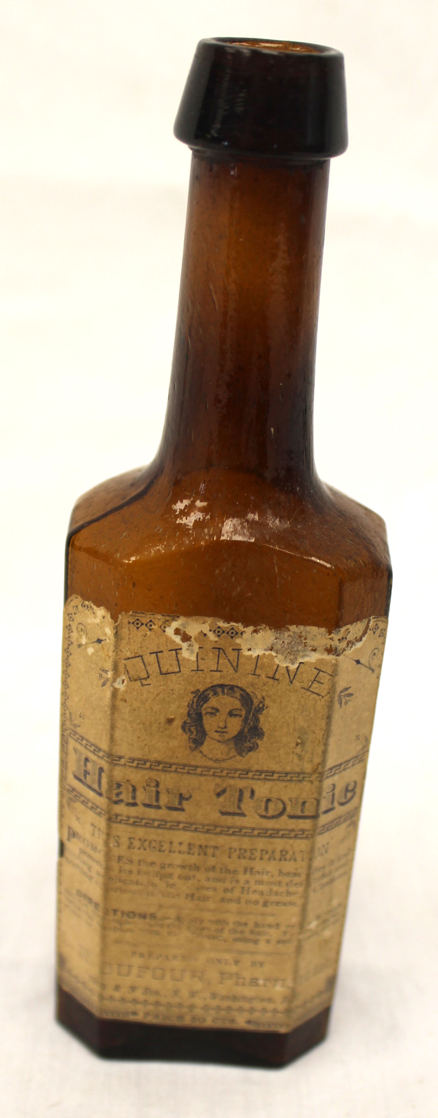Early amber glass bottle w orig label "Quinine Hair Tonic" - 7 1/2" tall: Early amber glass bottle w orig label "Quinine Hair Tonic" - 7 1/2" tall