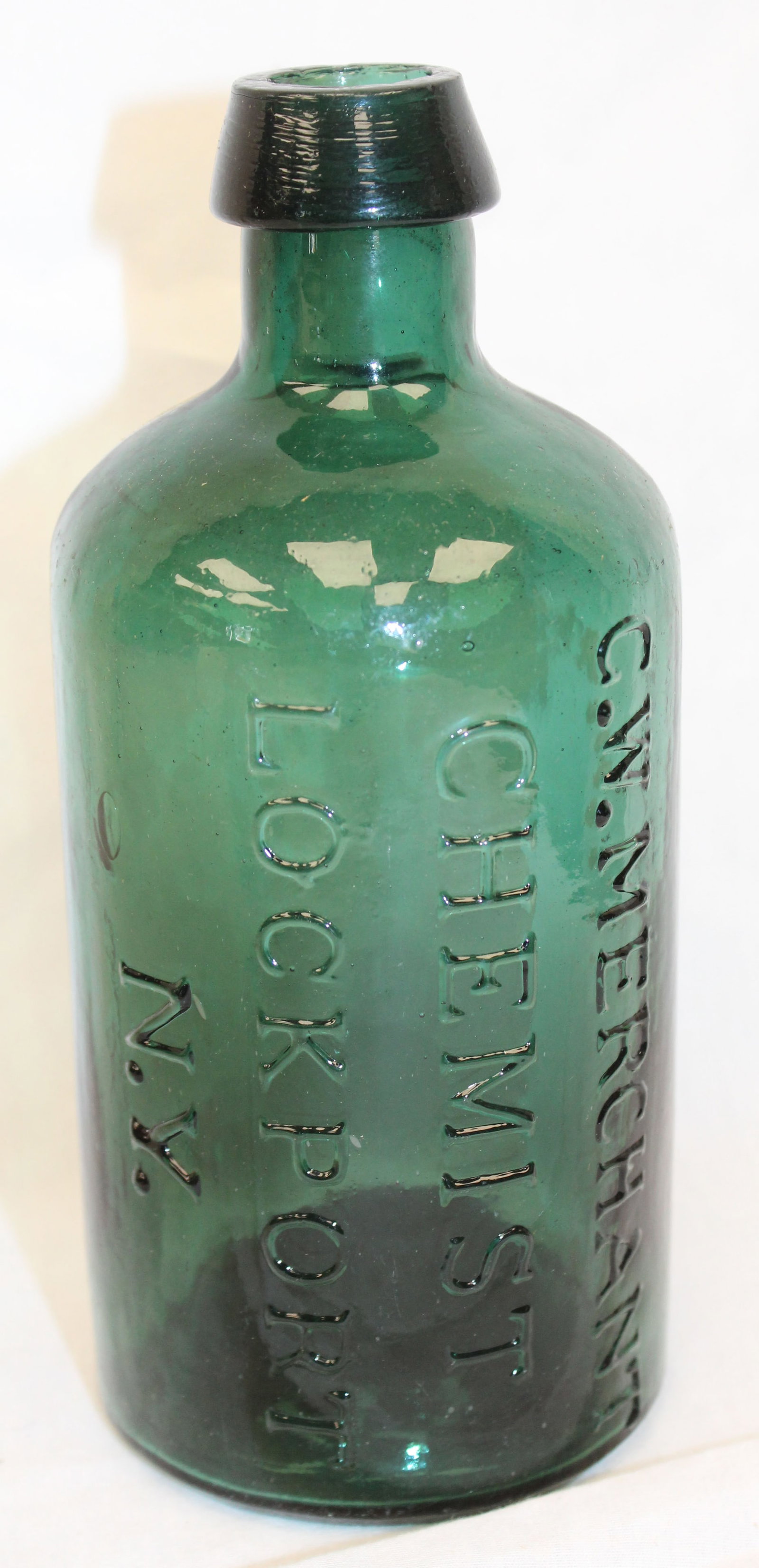 Early green glass bottle - "CW Merchant Chemist Northport, NY" - 7" tall: Early green glass bottle - "CW Merchant Chemist Northport, NY" - 7" tall