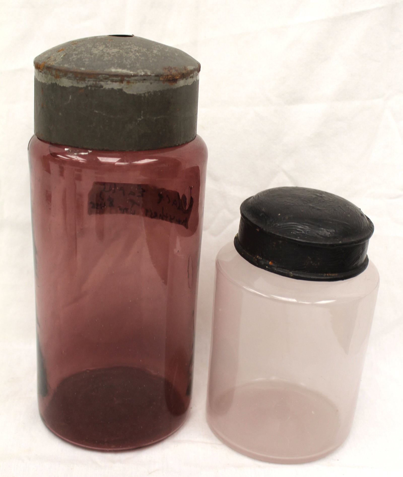 Lot of 2 early glass jars w metal lids - 1 in rose & 1 in blush - 10" & 7" tall (1 of 9)