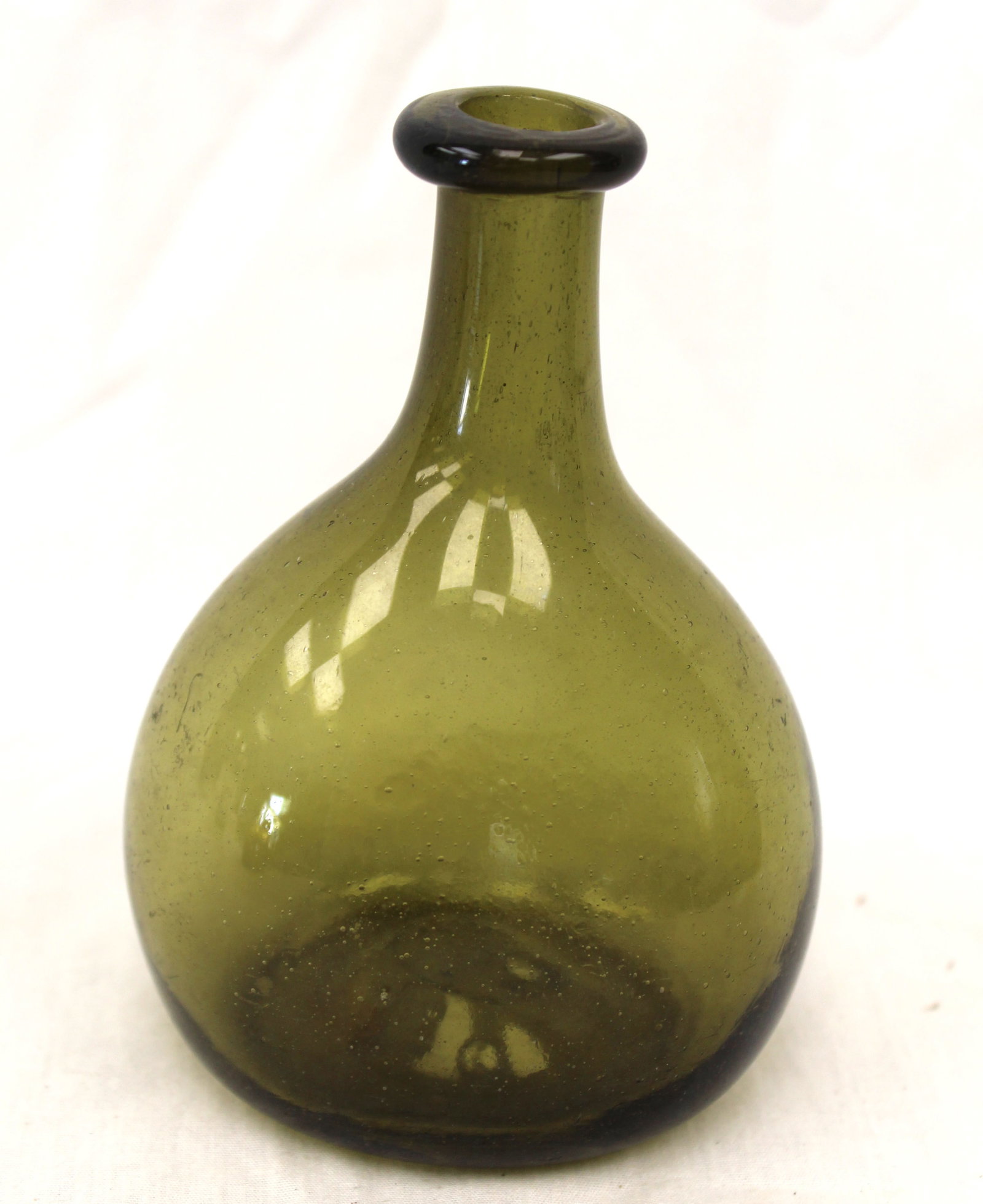 Early green glass small chestnut bottle - 4 1/2" tall: Early green glass small chestnut bottle - 4 1/2" tall