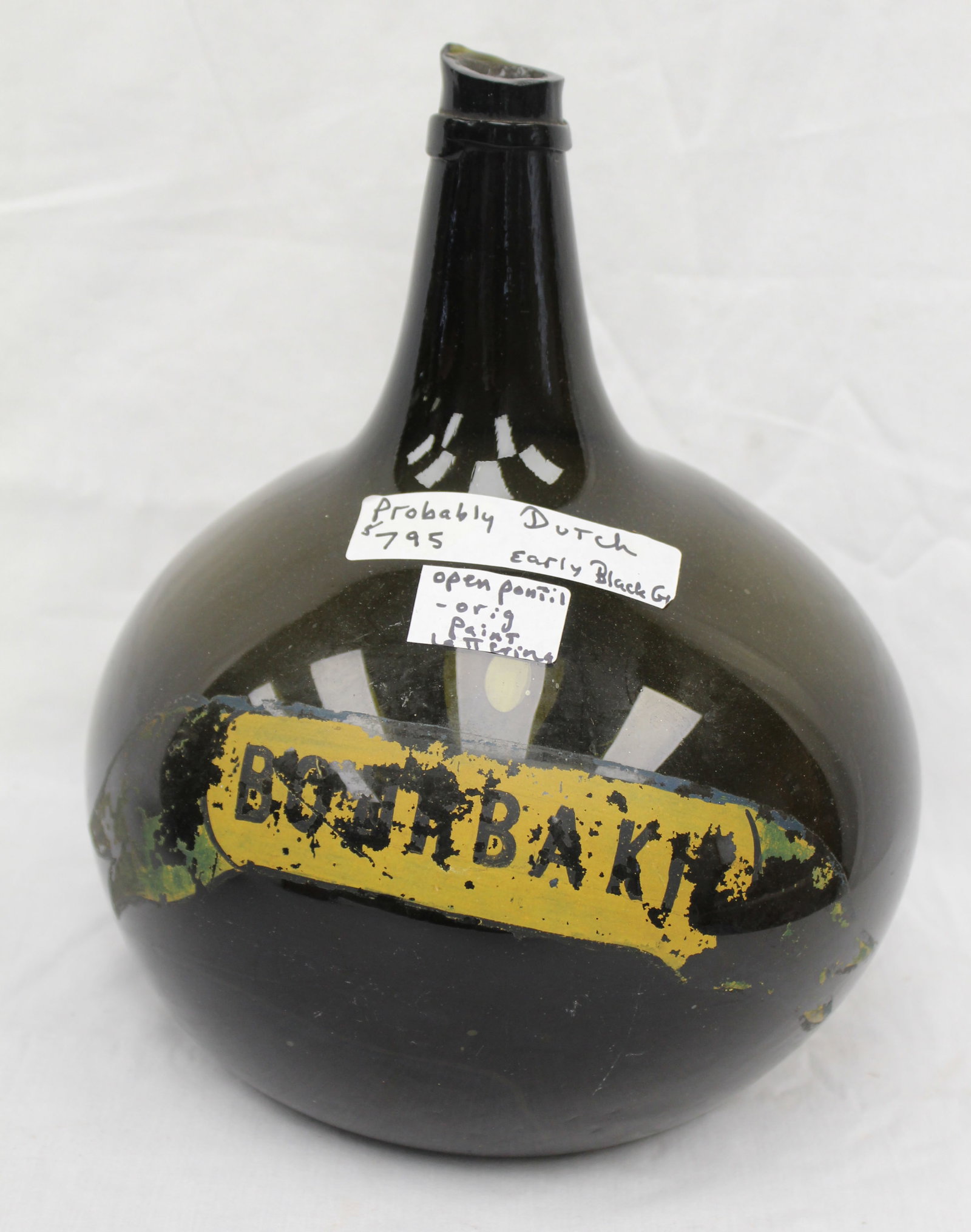 Early dark green/black glass demijohn w label - 12" tall: Early dark green/black glass demijohn w label - 12" tall