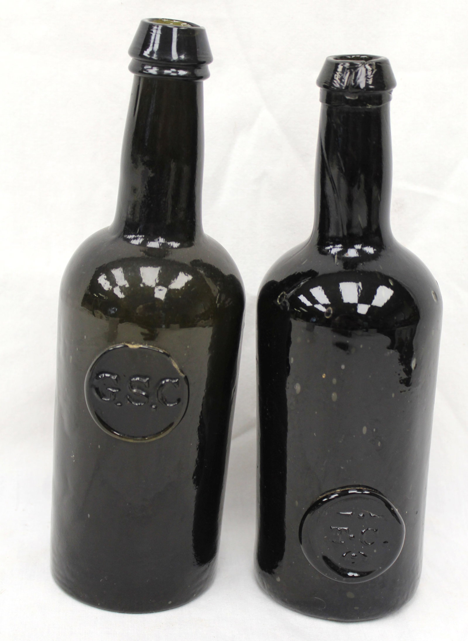Lot of 2 early black glass bottles w seals - 8 1/2" & 9" tall: Lot of 2 early black glass bottles w seals - 8 1/2" & 9" tall