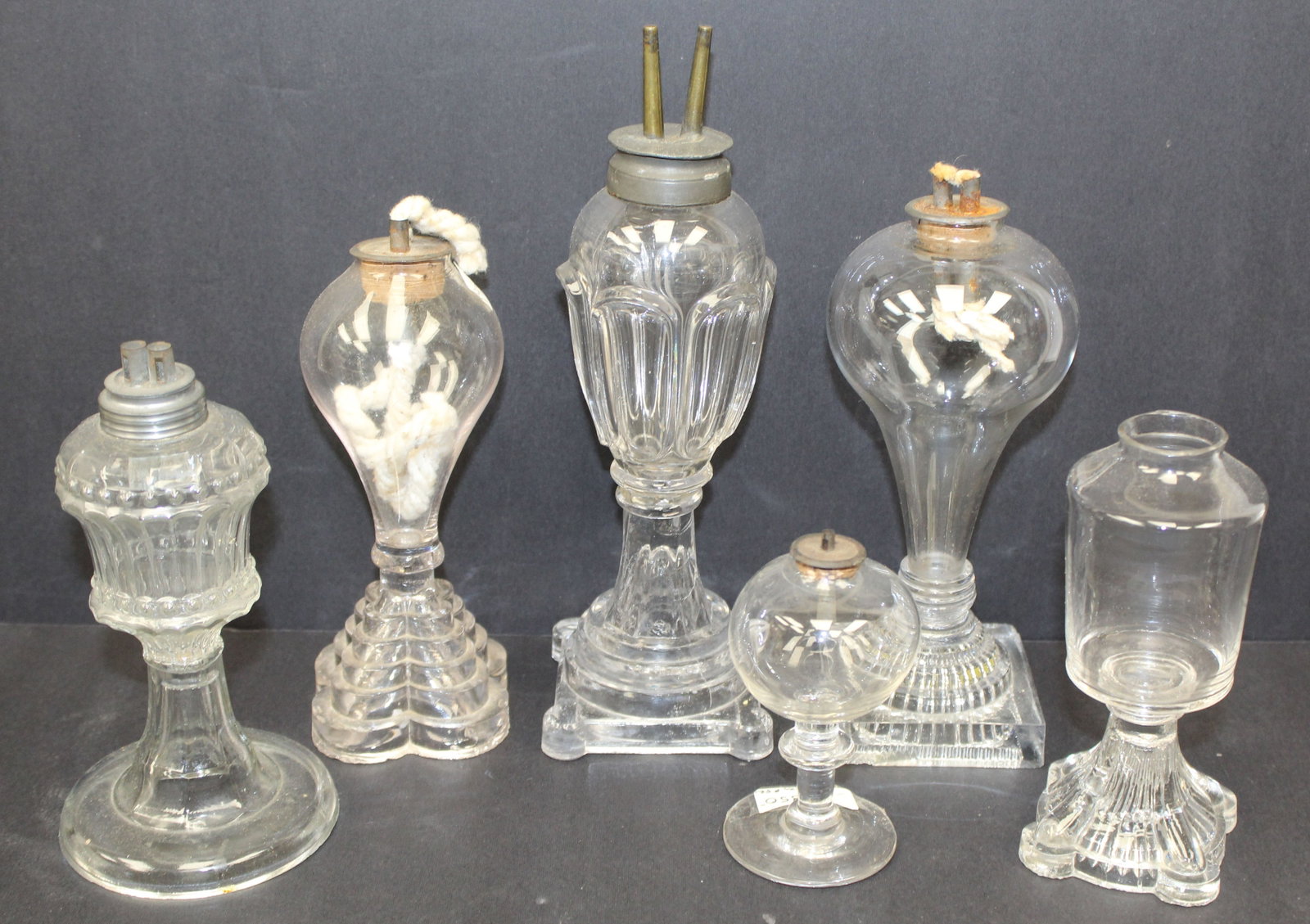 Lot of 6 early clear glass whale oil lamps - 4 1/2" - 10" tall (1 of 8)