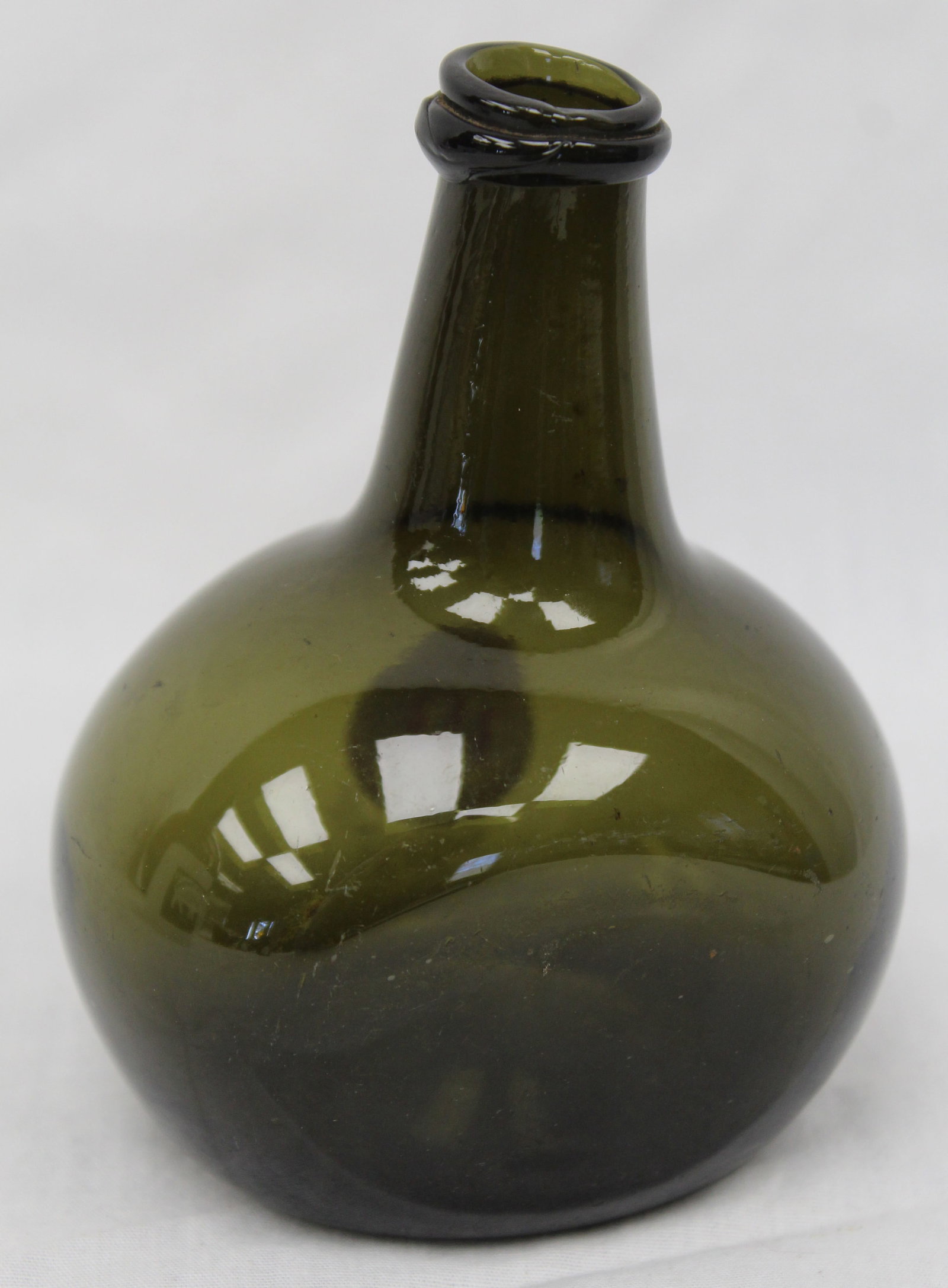 Early green glass small chestnut bottle - 4" tall: Early green glass small chestnut bottle - 4" tall