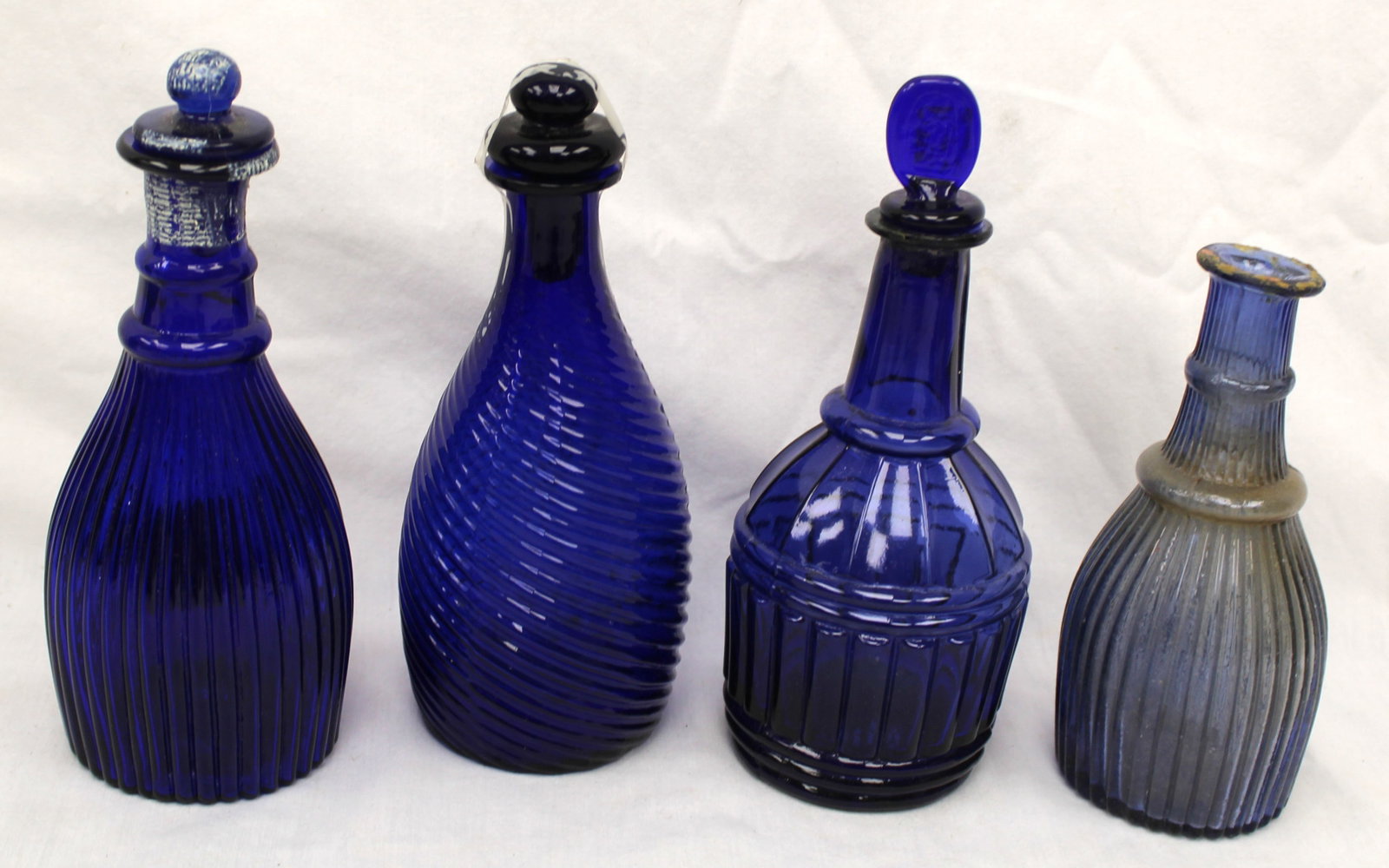 Lot of 4 early cobalt glass cruets - 1 missing stopper - 5 1/2" - 6 3/4" tall: Lot of 4 early cobalt glass cruets - 1 missing stopper - 5 1/2" - 6 3/4" tall