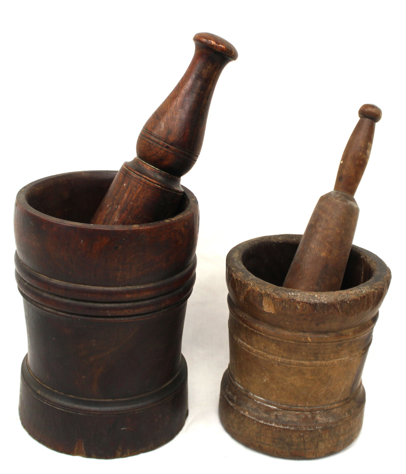 Lot of 2 antique carved wooden mortar & pestles - 7" tall x 6" diam & 9 1/2" tall x 7" diam (1 of 5)