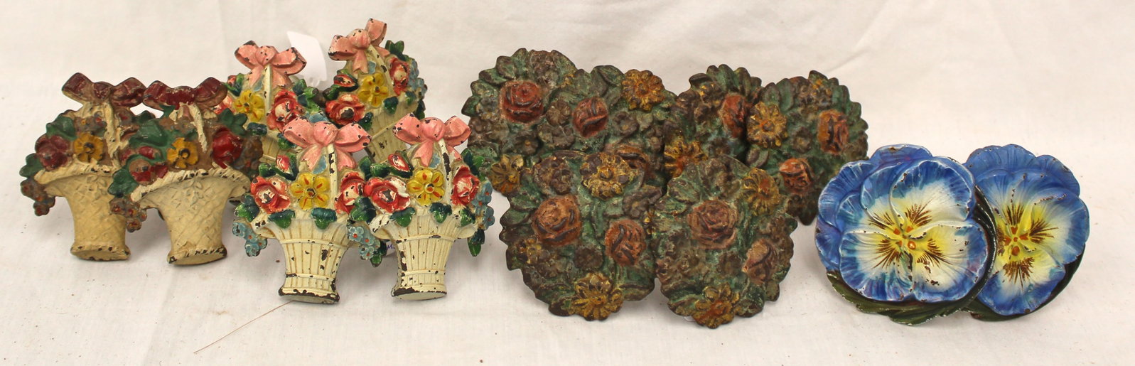 Large lot of painted iron floral motif curtain pulls (1 of 8)