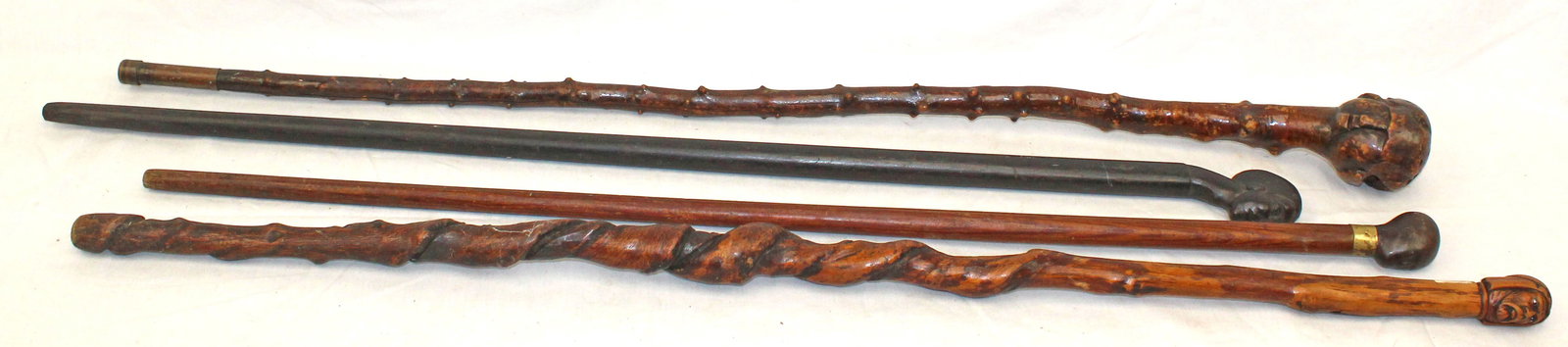 Lot of 4 carved wooden walking sticks w carved figural head handles - 34"-37" tall (1 of 7)