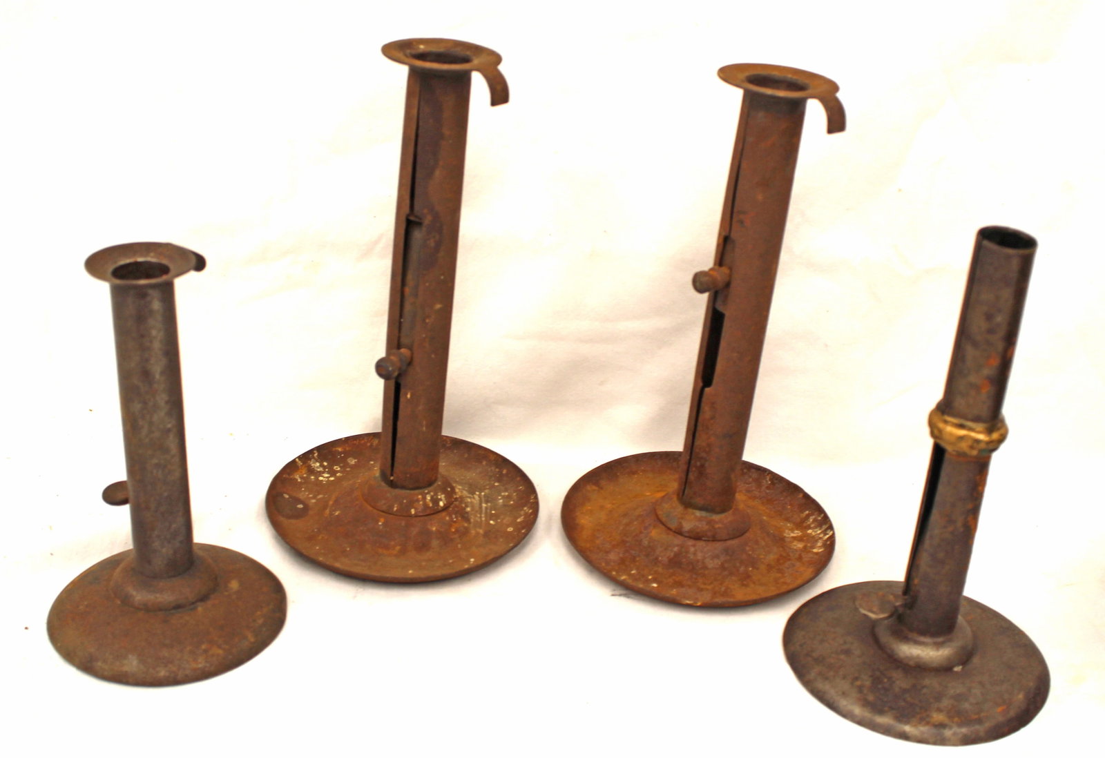 Lot of 4 antique tin hogscraper push up candlesticks incl a wedding band & a tall pair - 6 1/4"-8 (1 of 9)