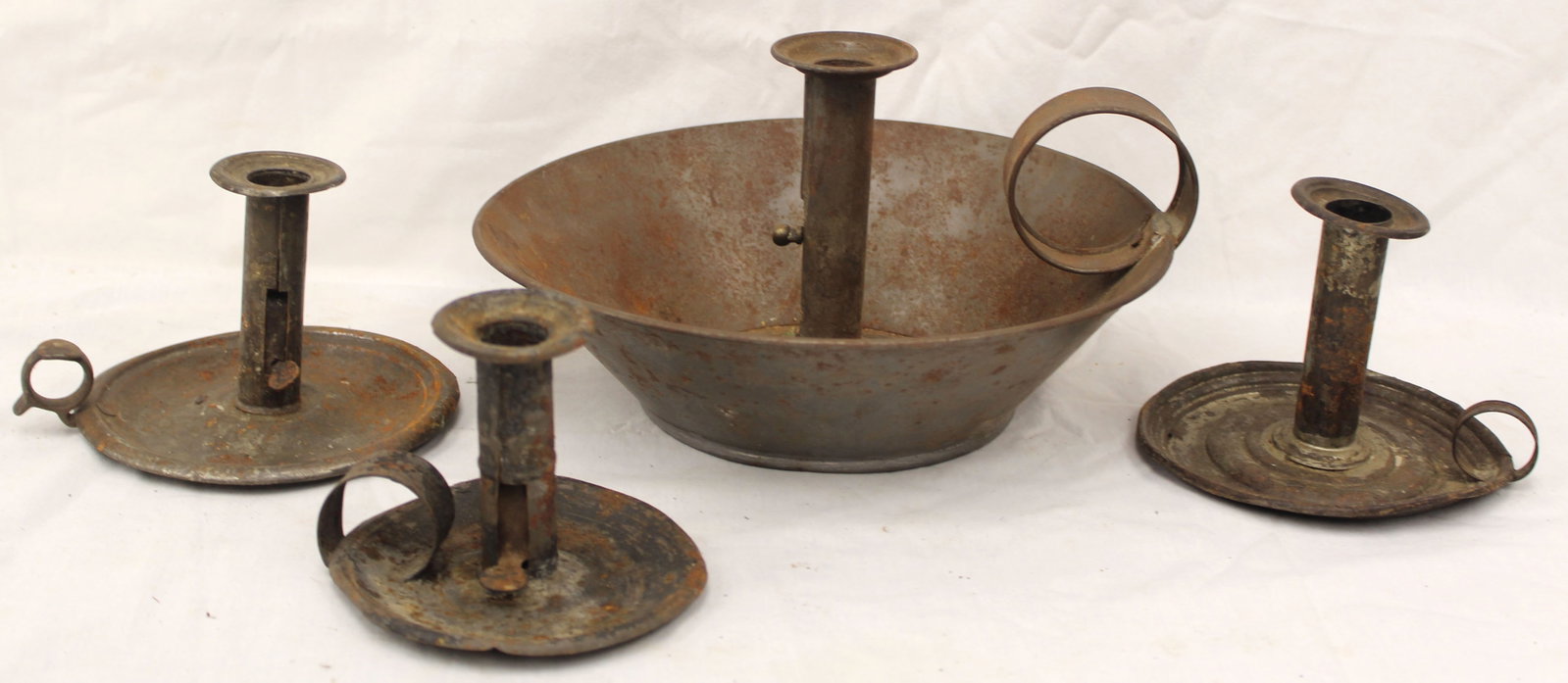 Lot of 4 antique tin chambersticks incl a very large example - 3 1/2" x 4 1/2" diam - 6" x 10 1/2" (1 of 10)