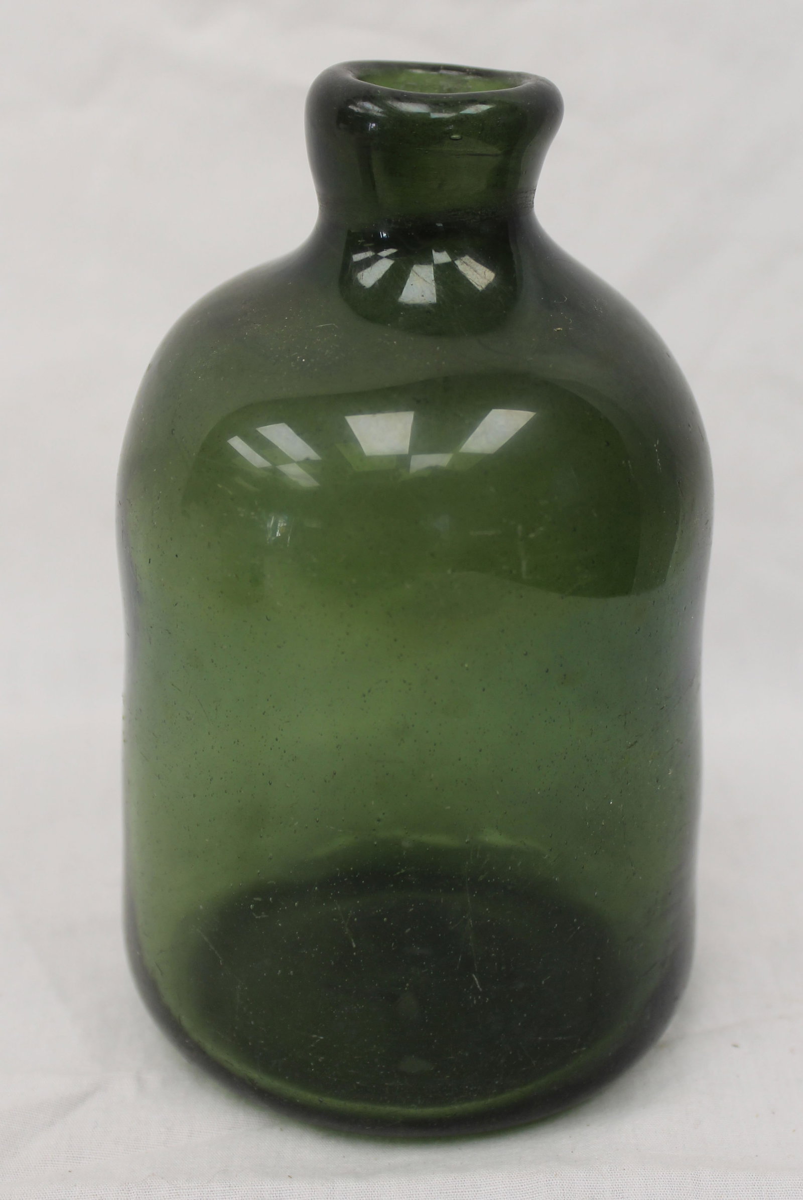 Early green glass bottle - 6" tall: Early green glass bottle - 6" tall