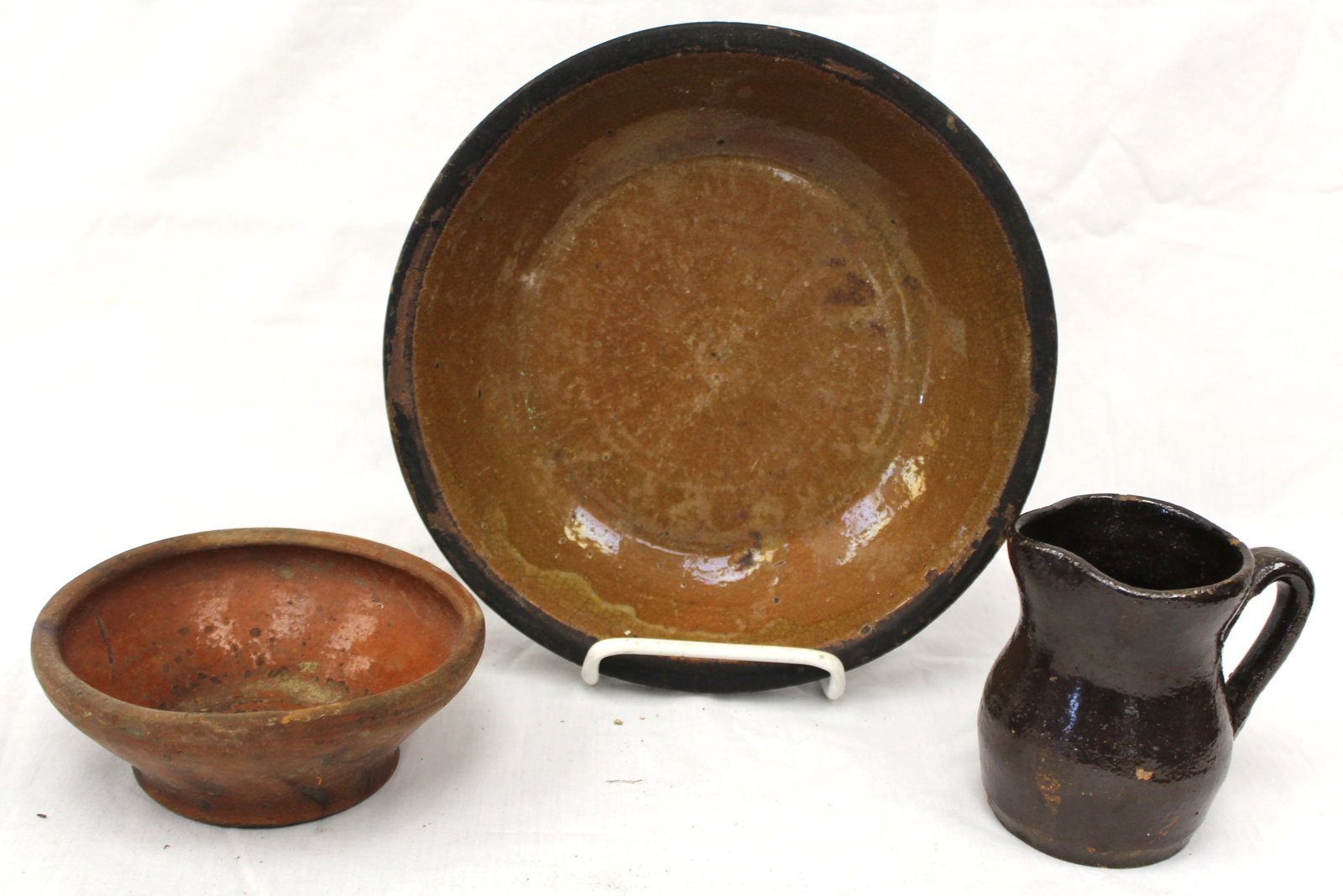 Lot of 3 antique redware items - 9" plate, 2 1/2" tall bowl & 4" tall pitcher - (1 of 10)