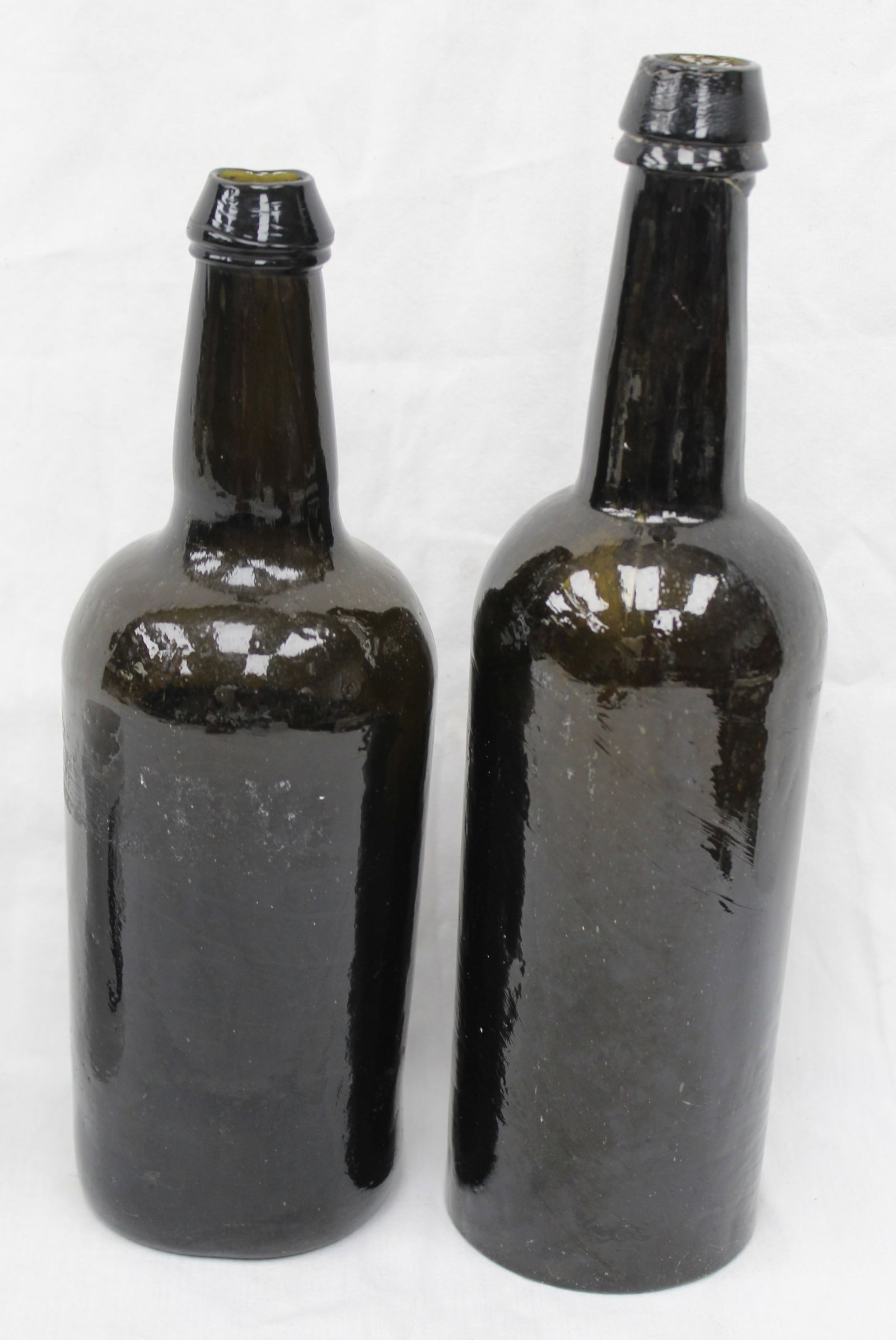 Lot of 2 early black glass bottles - 10 1/2" & 11 3/4" tall (1 of 5)