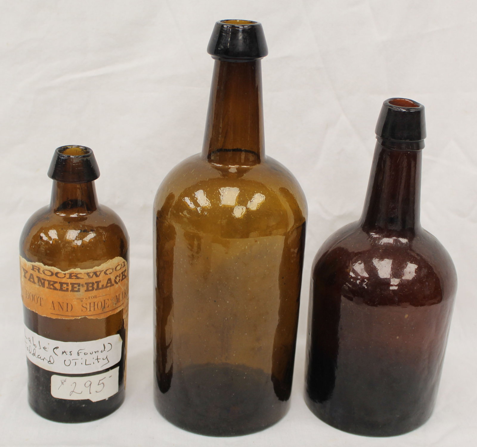 Lot of 3 early amber glass bottles - 1 w partial label - 7", 9" & 10 1/2" tall: Lot of 3 early amber glass bottles - 1 w partial label - 7", 9" & 10 1/2" tall