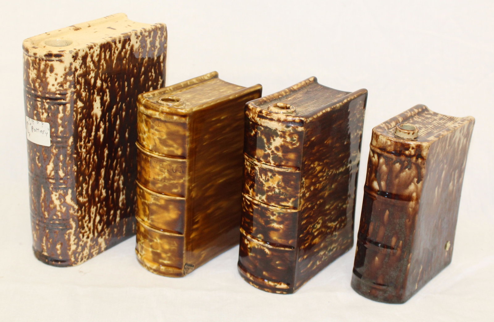 Lot of 4 antique Bennington book form flasks - 5"- 7 1/2" tall (1 of 4)