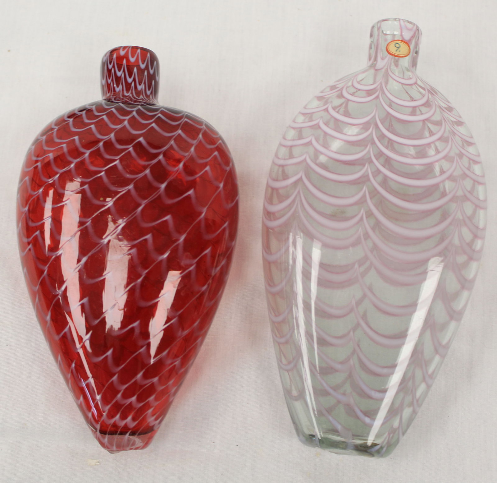 Lot of 2 early glass flasks in red & white & white w pink - 8 1/2" & 7 1/2" (1 of 5)
