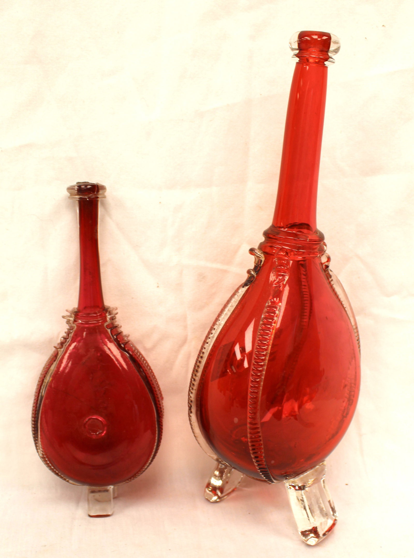 Lot of 2 early red glass bellows form bottle flasks w applied clear feet - 8" & 12" (1 of 11)