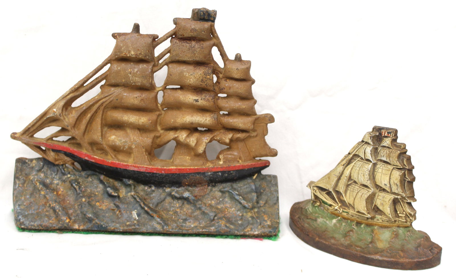 Lot of 2 painted cast iron ship motif doorstops - 6" & 10" tall (1 of 7)