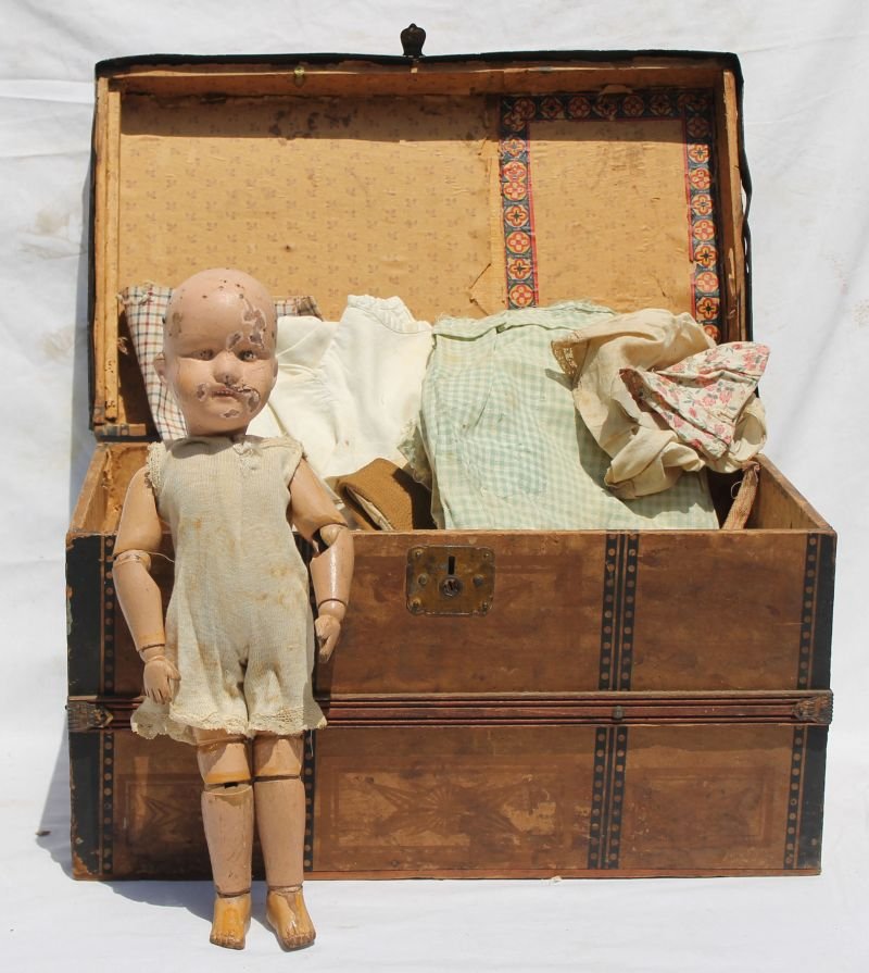 Schoenhut 15" doll in antique dolls trunk (18"wide x: Schoenhut 15" doll in antique dolls trunk (18"wide x 11" deep x 10 1/2" tall) full of antique dolls clothing ca 1920 - John Bemben Estate