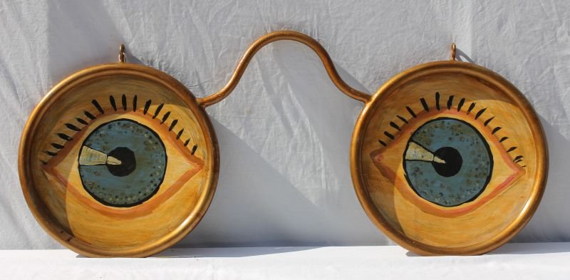 Very graphic eyeglass form Folk Art metal optometrist: Very graphic eyeglass form Folk Art metal optometrist trade sign in orig multi-colored paint - 35" long x 15 1/2" tall