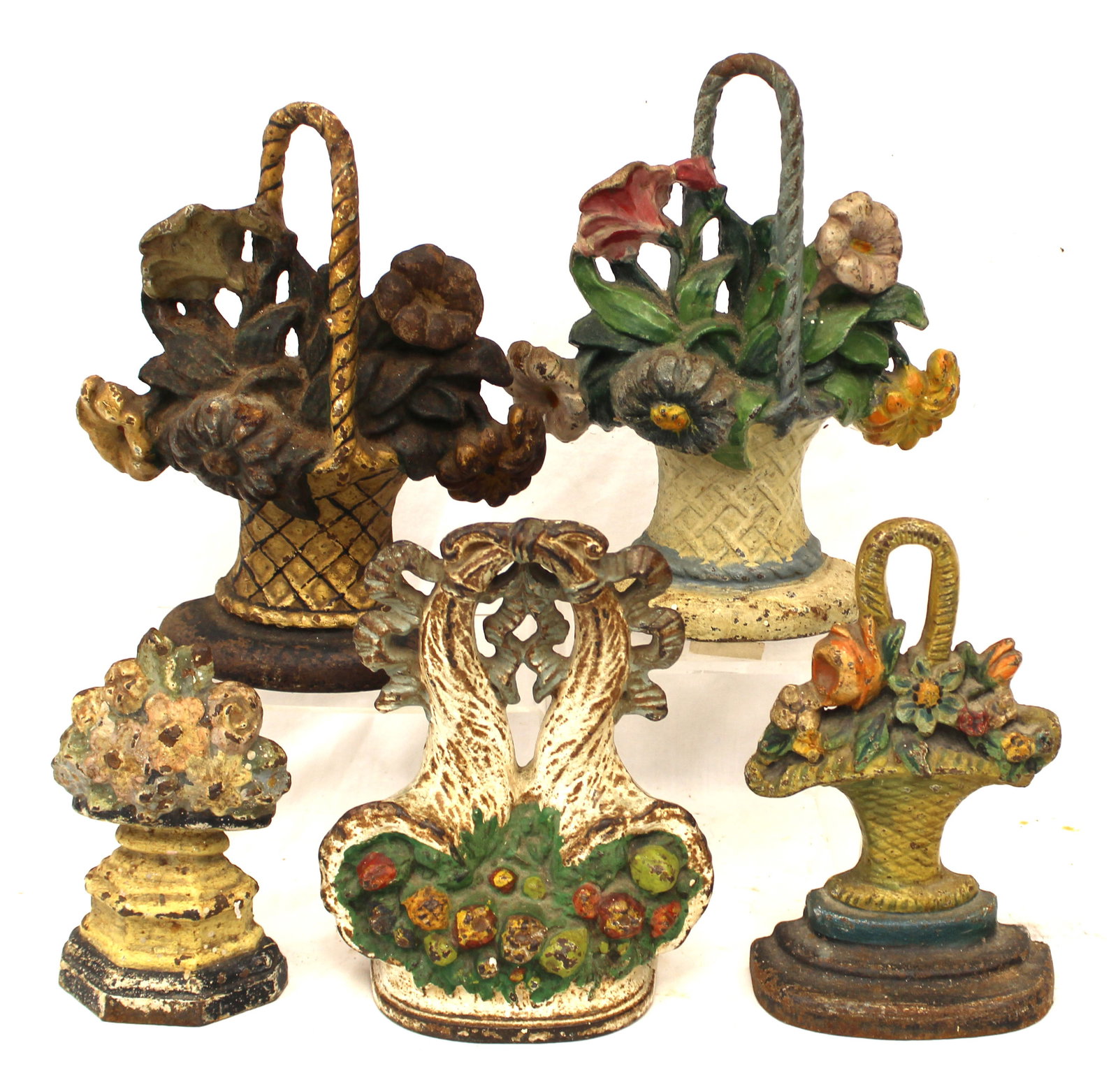 Lot of 5 antique cast iron basket of flowers dooorstops - 6 1/2" - 9 1/2" tall: Lot of 5 antique cast iron basket of flowers dooorstops - 6 1/2" - 9 1/2" tall