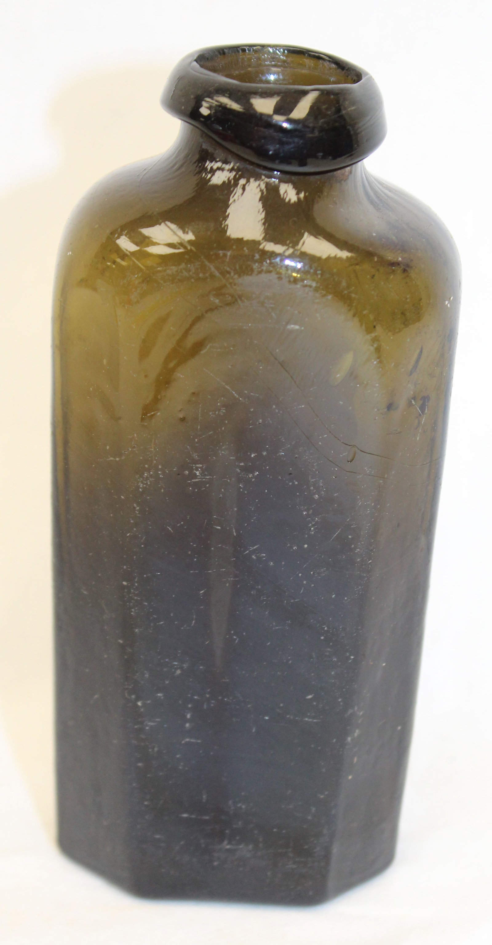 Early green glass octagonal shaped bottle - 5 1/4" tall (1 of 7)