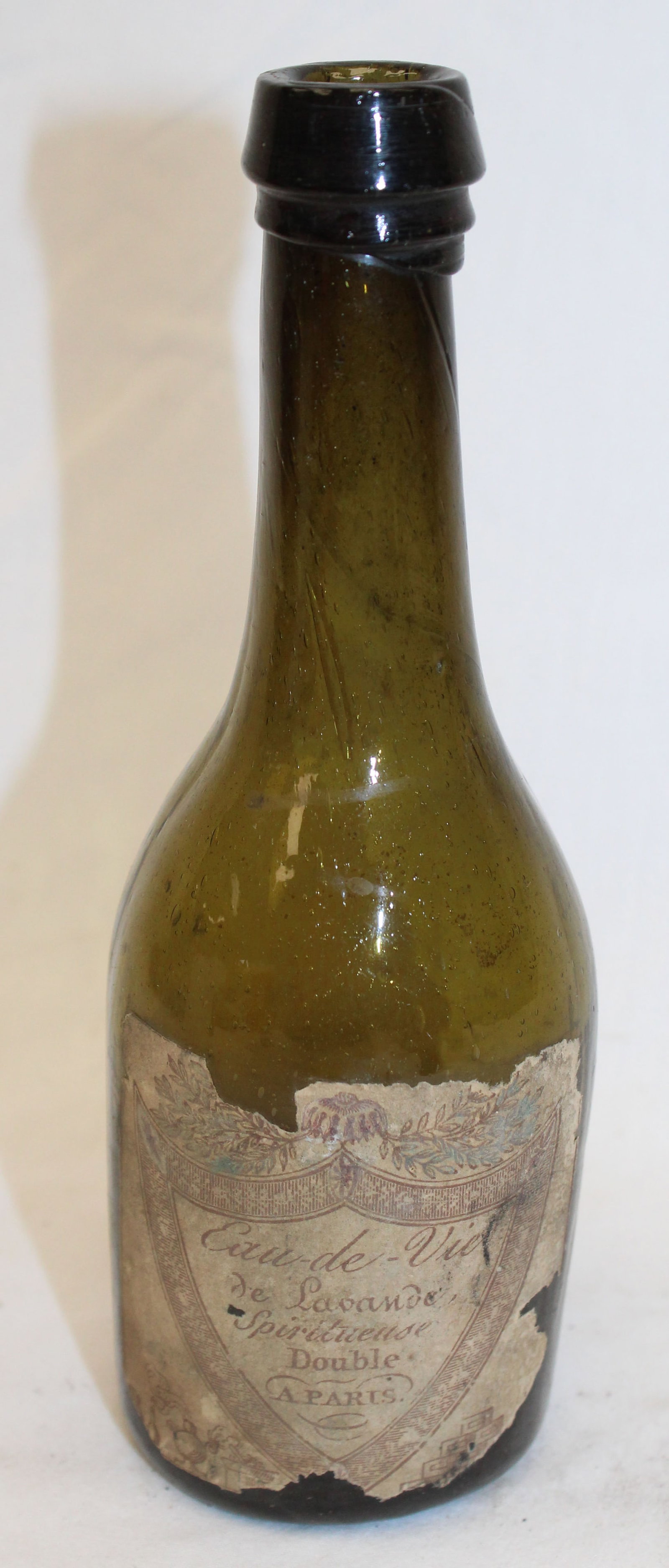 Early green glass bottle w French label "Eau-de-Vie de Lavande?" - 7" tall