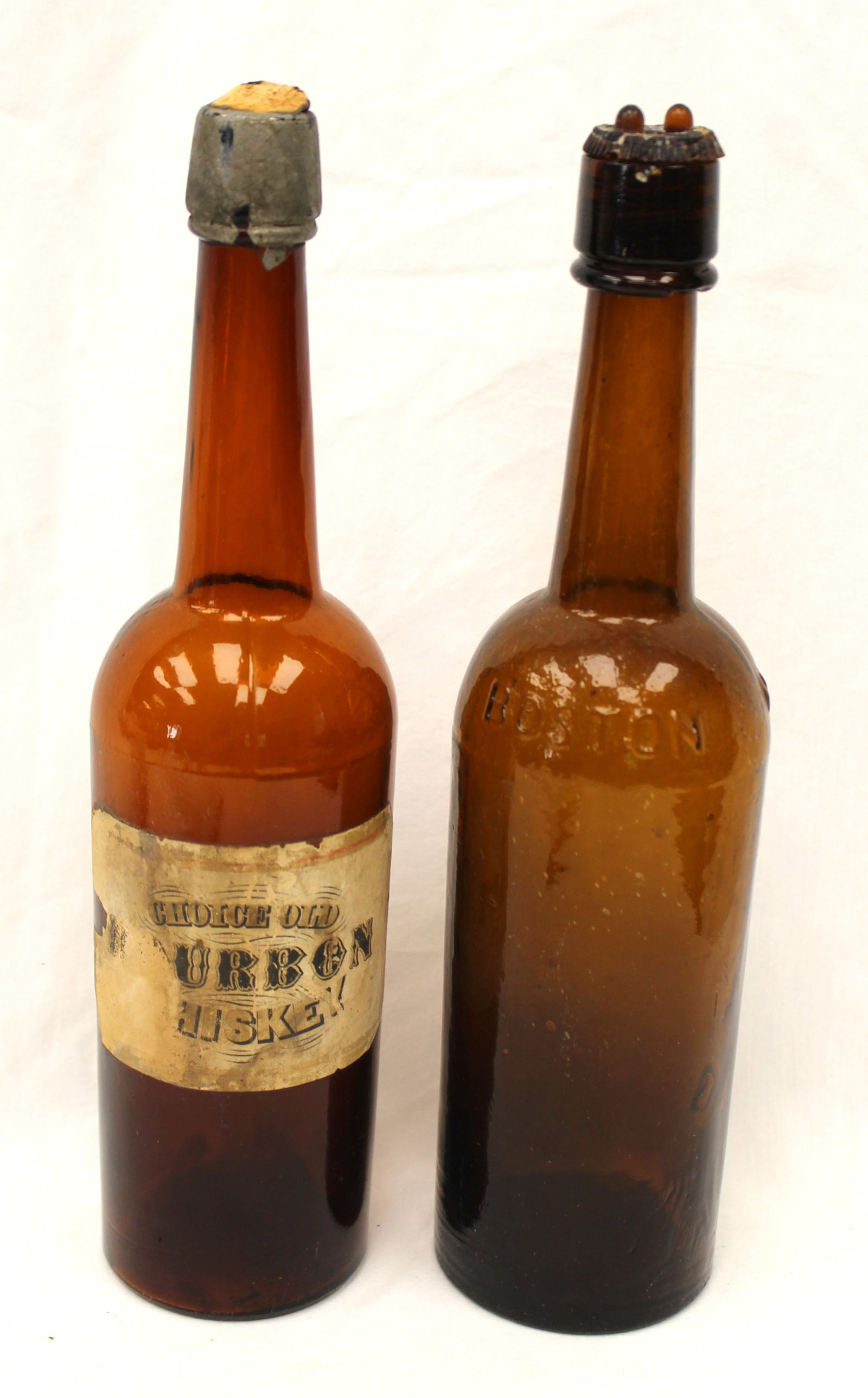 Lot of 2 early amber glass bourbon bottles - 1 w partial label - 1 marked Boston - 12" tall (1 of 9)