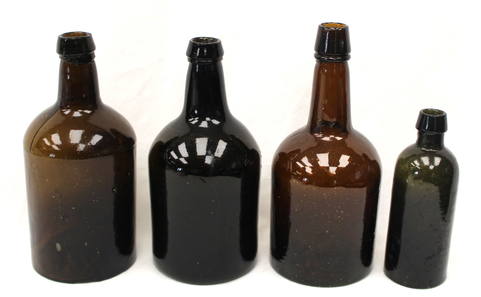 Lot of 4 early dark amber/black glass bottles - 6 1/2"-9 1/4" tall: Lot of 4 early dark amber/black glass bottles - 6 1/2"-9 1/4" tall