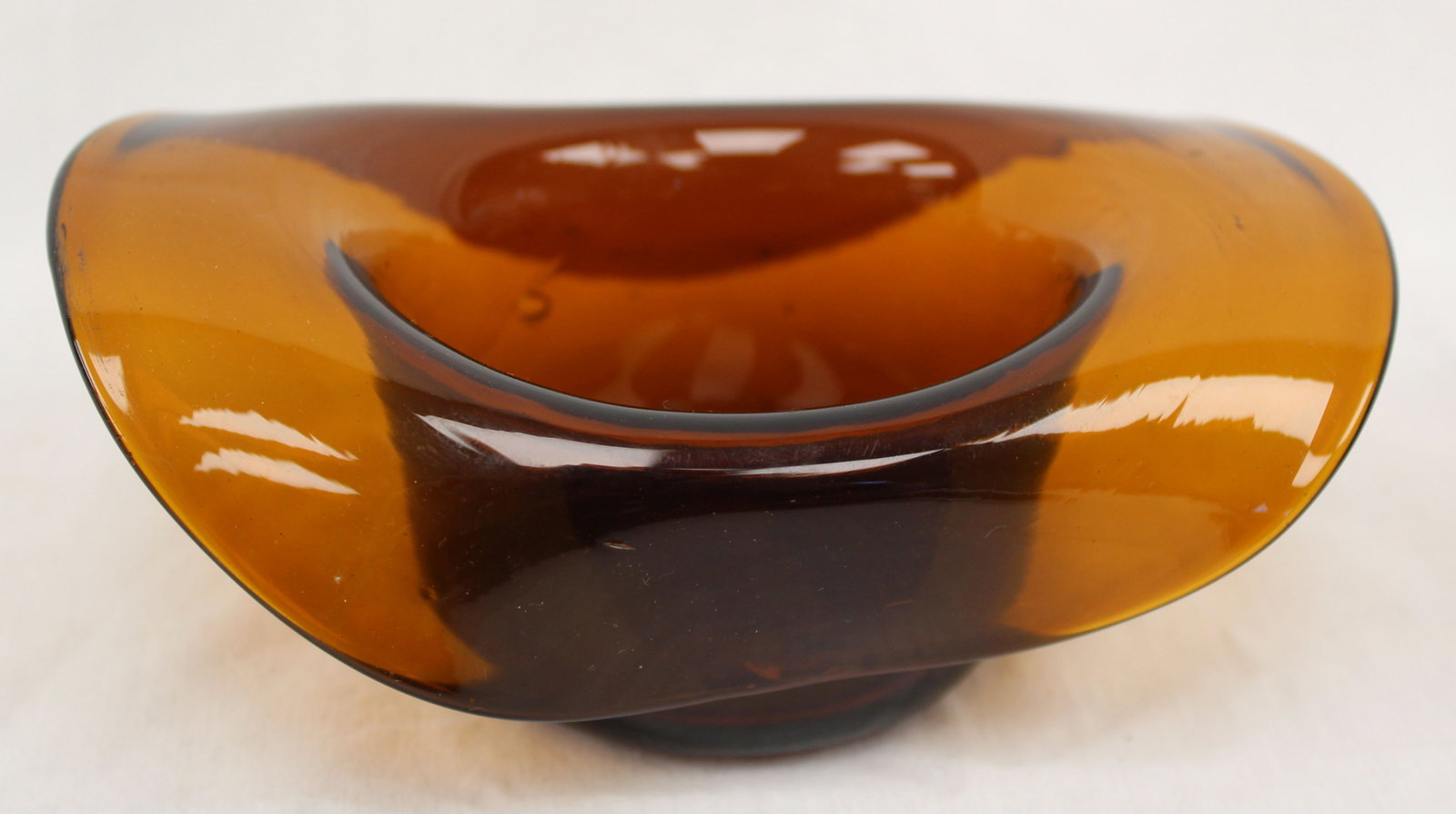 Early amber glass hat - 2" tall x 6"x 3 3/4": Early amber glass hat - 2" tall x 6"x 3 3/4"