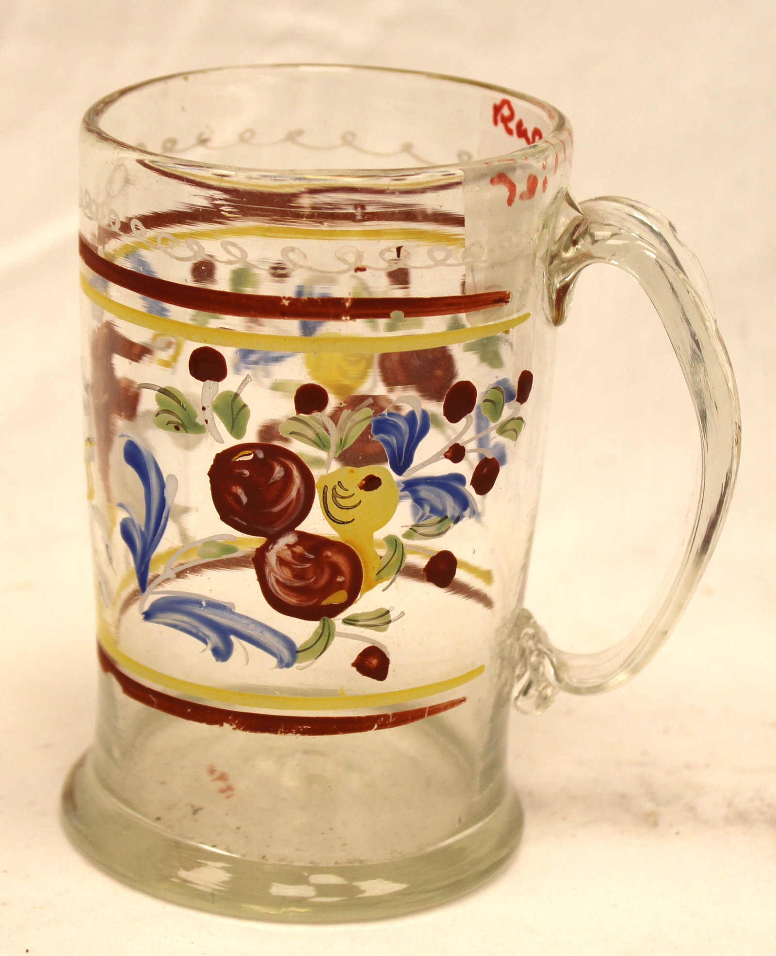 Early clear glass mug w colorful paint decoration depiction a soldier - 5" tall