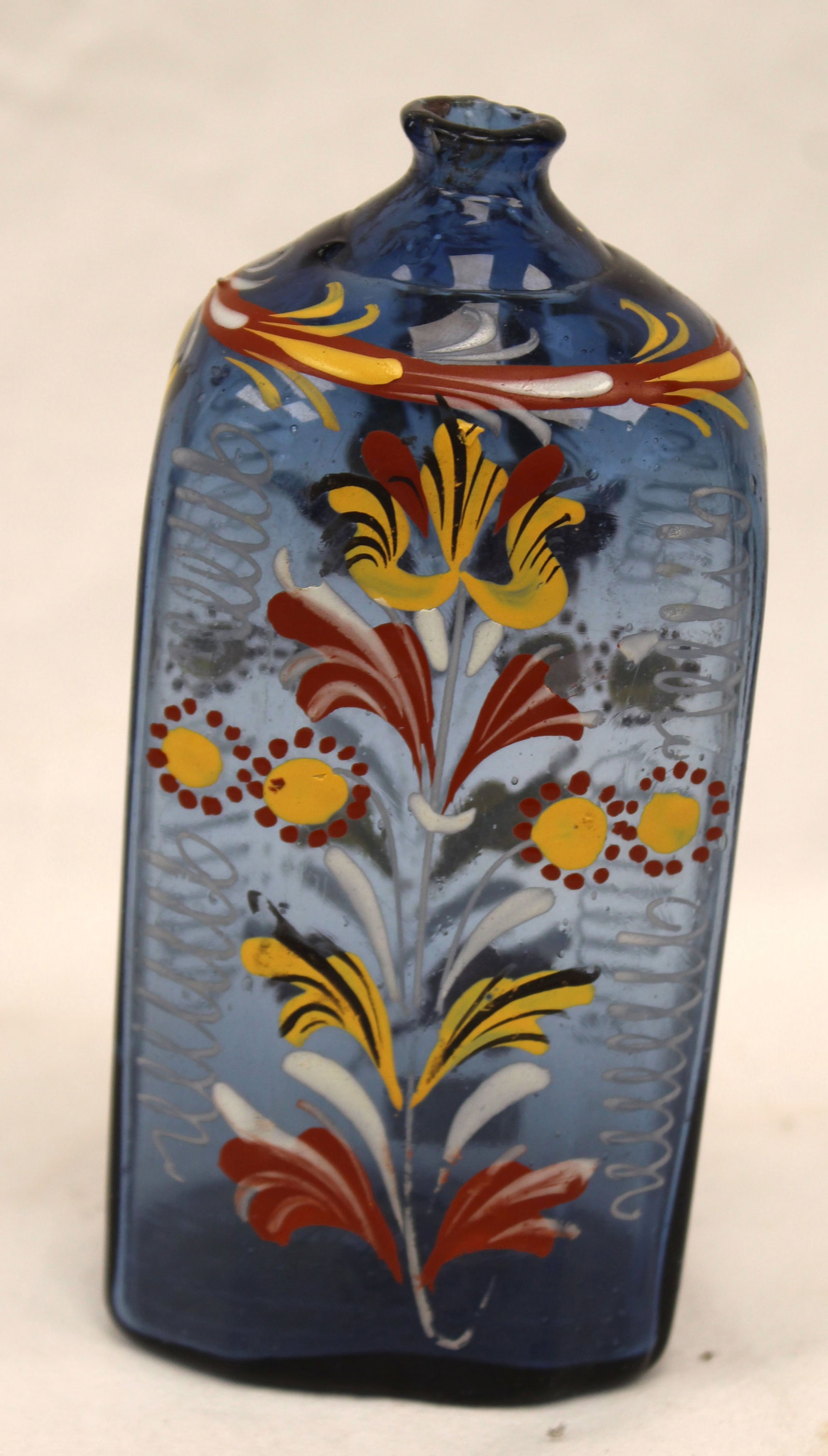 Early blue glass bottle w multi color floral dec - 5 1/2" tall