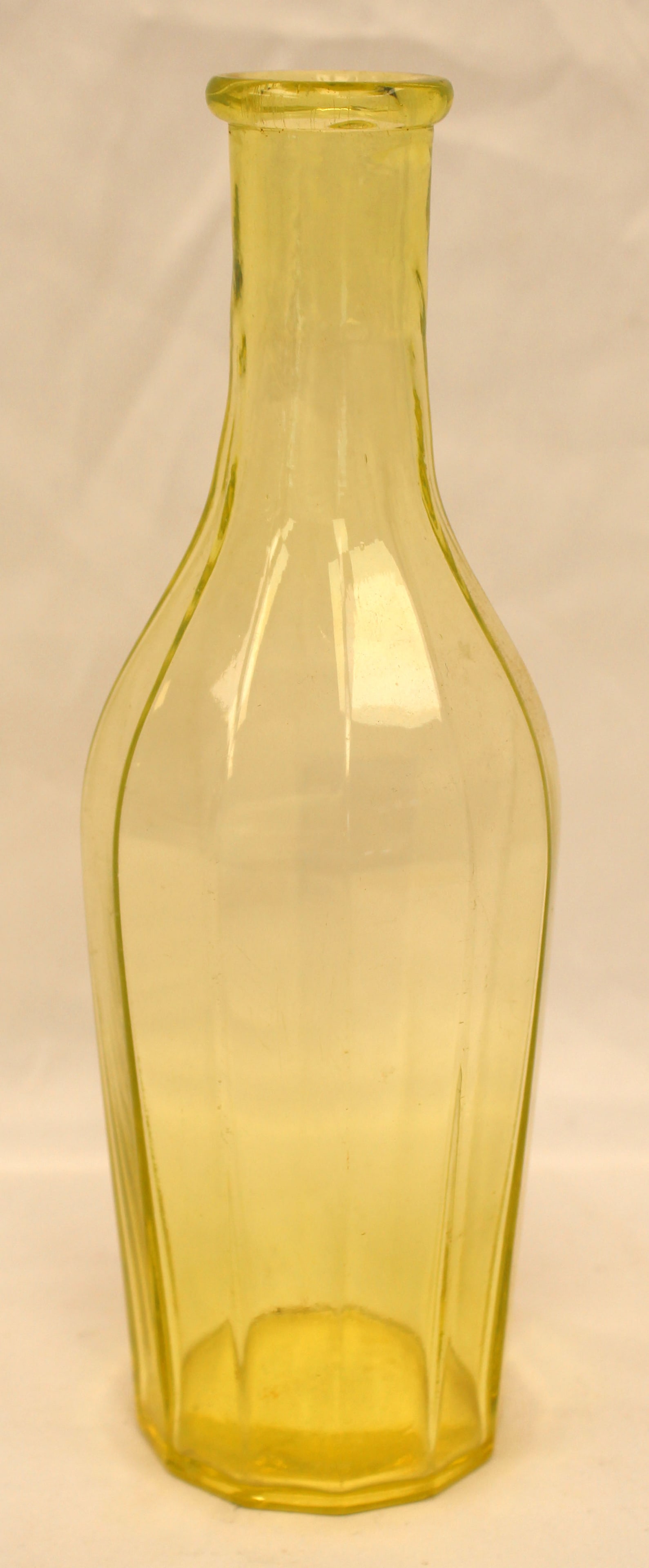 Early canary glass bottle - 9 3/4" tall (1 of 5)