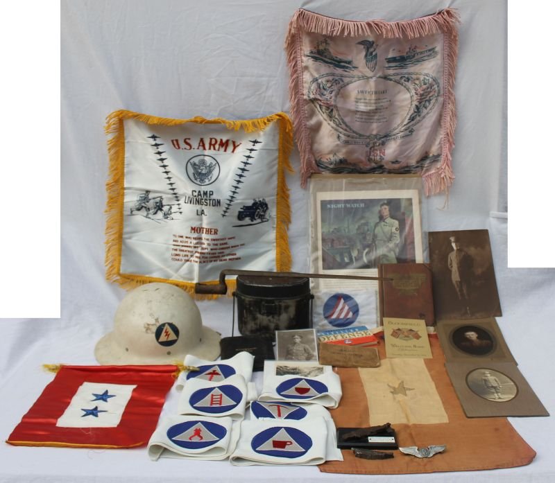 lot of WWII era American military items incl song: lot of WWII era American military items incl song books, window flag, pillows, night watch armbands, helmet, badges, shell fragments, etc