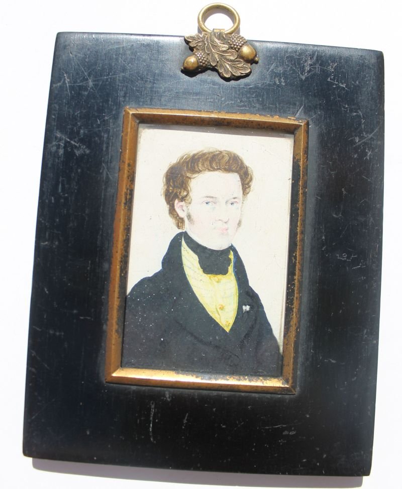 ca 1810 English 3"x2" miniature portrait on porcelain: ca 1810 English 3"x2" miniature portrait on porcelain of a gentleman in black jacket w yellow cravat set in orig 5"x4" ebonized wood frame