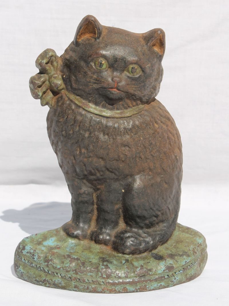 ca 1920 fine detail cast iron Hubley cat w bow doorstop: ca 1920 fine detail cast iron Hubley cat w bow doorstop in orig paint & excellent condition - 8" tall