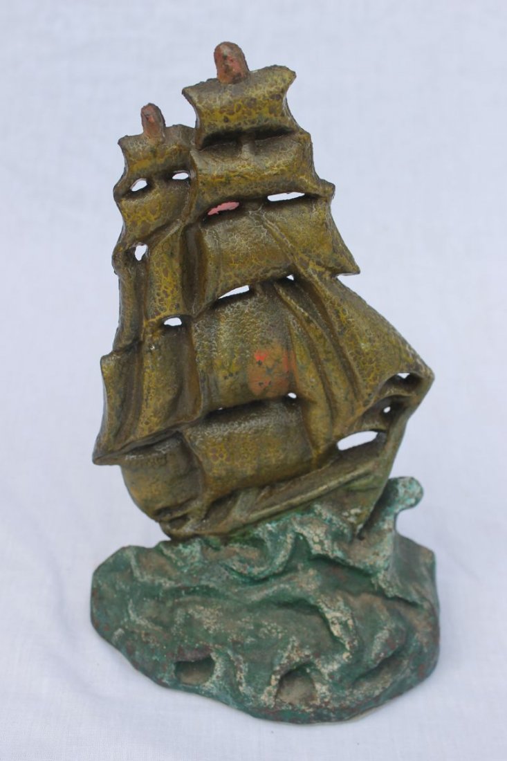 antique cast iron doorstop "Ship in a Storm" - 9 1/4": antique cast iron doorstop "Ship in a Storm" - 9 1/4" tall - pictured in "Figurative Cast Iron" book