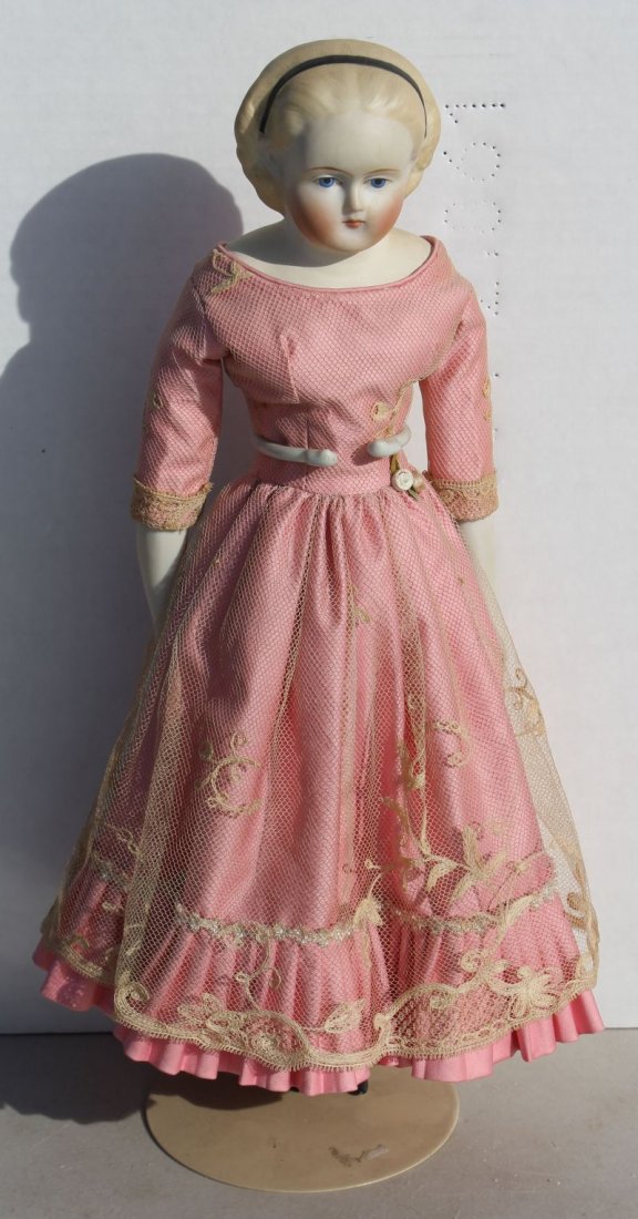 ca 1870-90 Parian shoulder head doll w Alice in: ca 1870-90 Parian shoulder head doll w Alice in Wonderland painted hairband, bisque forearms (possible replacements), beautifully dressed in pink dress w overlace, cloth body in excellent condition - 