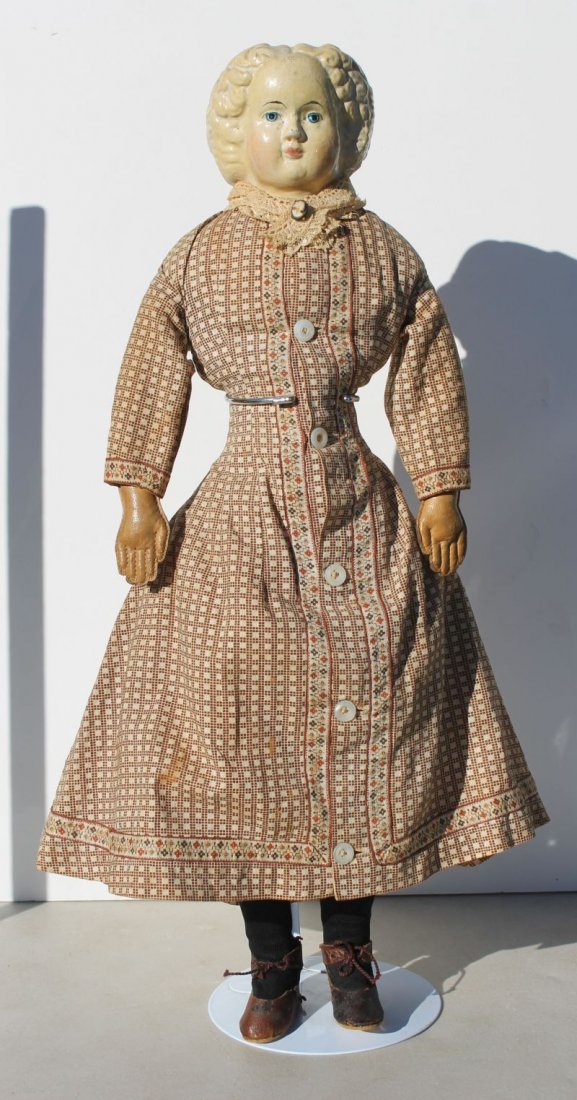 ca 1880 papier mache Greiner shoulder head doll on orig: ca 1880 papier mache Greiner shoulder head doll on orig cloth body w leather arms & cloth legs blue painted eyes. Appropriately dressed in antique underwear & antique machine made dress - 18" tall - G