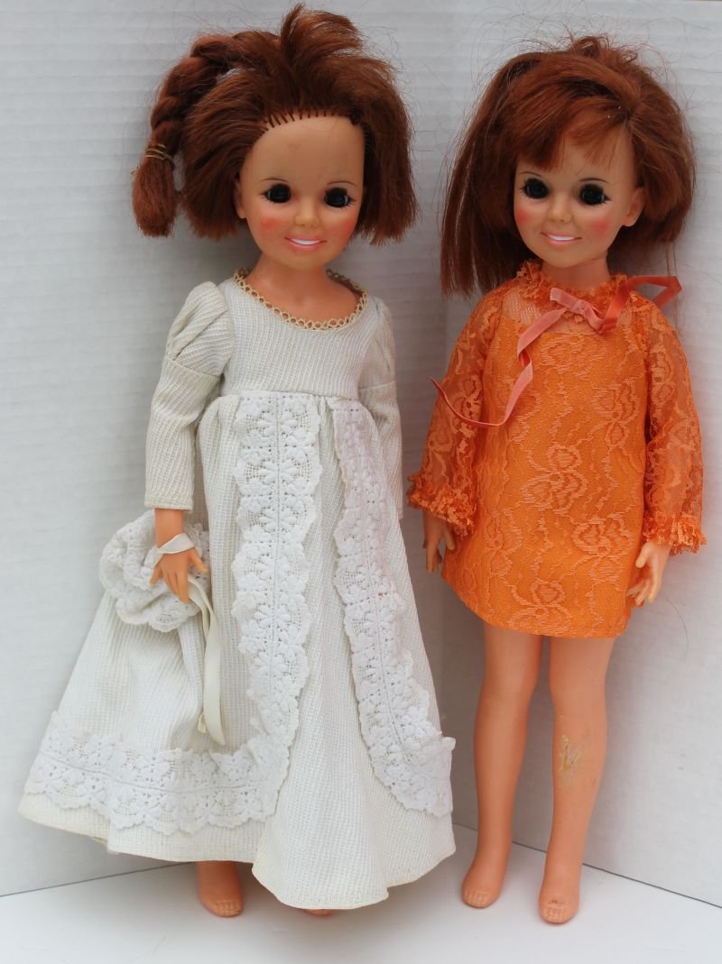 two ca 1969-1974 Ideal "Chrissy - Hair Grows" doll: two ca 1969-1974 Ideal "Chrissy - Hair Grows" doll (knob in back) - 1 in orig orange dress - both in as found condition - 18" tall