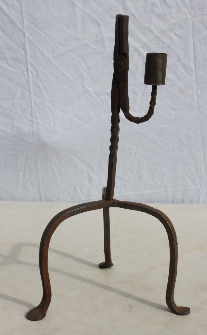 Antique iron table top rush light on tripod base ending: Antique iron table top rush light on tripod base ending in penny feet - 14" tall