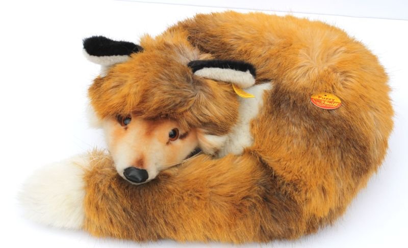 lot of 2 Vintage Steiff foxes - 1 large in recumbant: lot of 2 Vintage Steiff foxes - 1 large in recumbant position ("Fuzzy") w button, tag, orig hang tag & glass eyes, the other a 9" mohair w glass eyes & orig button & tag in ear