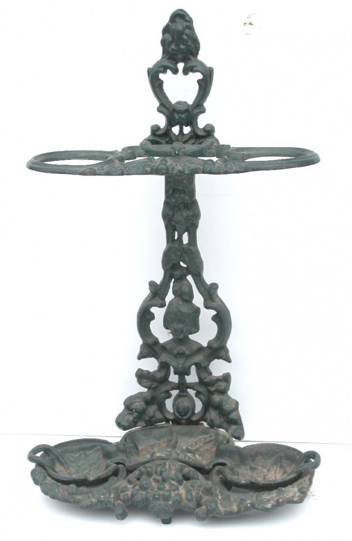 Victorian cast iron umbrella stand w removable tray in: Victorian cast iron umbrella stand w removable tray in old dark green paint w floral & figural dec - 26" tall