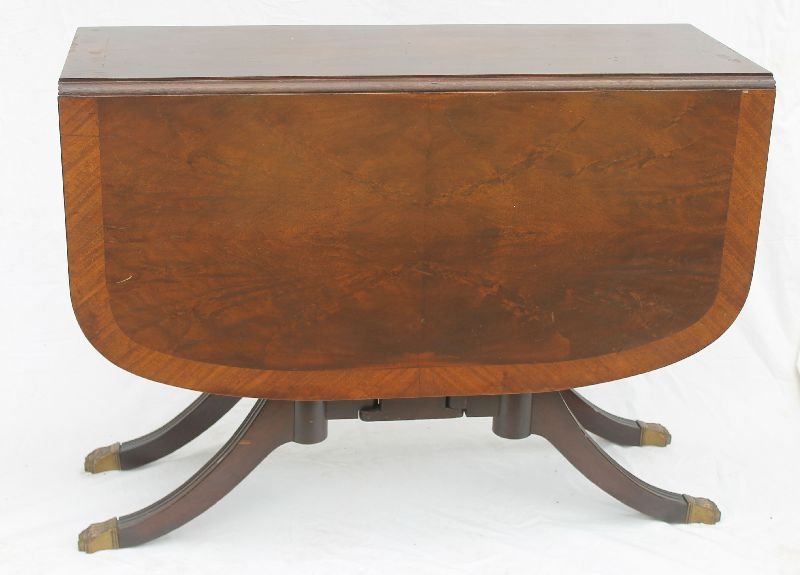 quality 1930's Duncan Phyfe style mahogany swing leg: quality 1930's Duncan Phyfe style mahogany swing leg dropleaf table on 4 legs ending in brass paw feet - 39" long